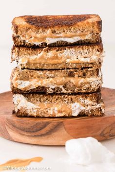 four slices of grilled cheese sandwich stacked on top of each other with marshmallows